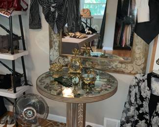 Mirrored pedestal table. Matching painted Mirror.  Painted perfume bottles. Women's clothes