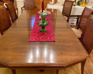 Ethan Allen dining table with two leaves, 8 chairs and a set of table pads