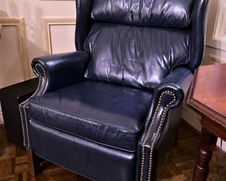 Navy blue leather recliner chair by Burris with brass nailhead trim.  