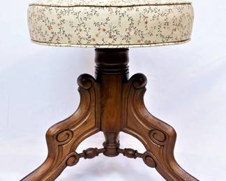 Antique piano stool with ornate walnut wood base