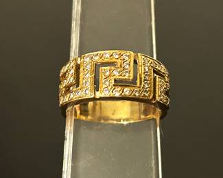 Gold (marked 750 which is 18k) Greek key styled ring , size 7........To register in order to place bids go to www.capitolsalesservices.hibid.com  