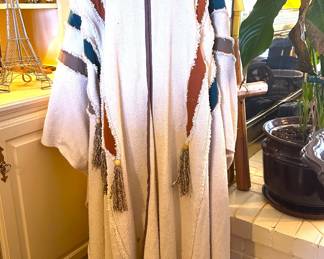 Vintage Poncho of Handwoven Fiber by Takasami.  Takasami of Guadalajara, Mexico provides high fashion that utilizes elements of traditional Mexican design and folklore.    It is an unisex garment for any size.........To register in order to place bids go to www.capitolsalesservices.hibid.com 