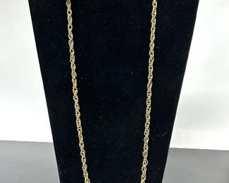 A long 14k yellow gold rope chain necklace which is marked 585 (14k) with a wight of 34.64 DWT