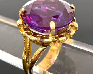 Purple Sapphire  & Gold cocktail ring from Egypt with 3 hallmarks, The first hallmark is purity mark of Arabic number for .750 then the second hallmark is an Ibis ( the iconic bird for Egypt) that represents gold, the 3rd hallmark represents the year it was made..  size 8.5........To register in order to place bids go to www.capitolsalesservices.hibid.com 