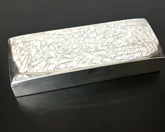 Vintage presentation sterling silver cigar box given in 1961 as a retirement gift of the Indiana representative of Buster Brown Shoes.  The lid has engravings of Buster Brown employees of that time.    Smith & Smith was based in Attleboro, Massachusetts.  They were purchased by Wallace Silver in 1958.  
