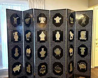 Mid century Chinese folding screen room divider with a black lacquer finish with mother of pearl inlay