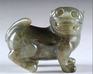 Lot 004  
Antique Chinese Celadon and Brown Jade Netske Foo Dog Amulet
