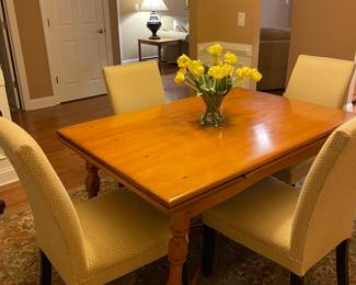 Vintage maple dining table with leaves in closed position under table