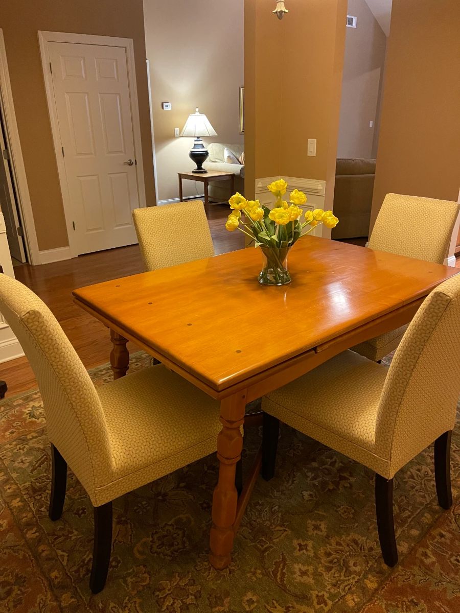 Vintage maple dining table with leaves in closed position under table