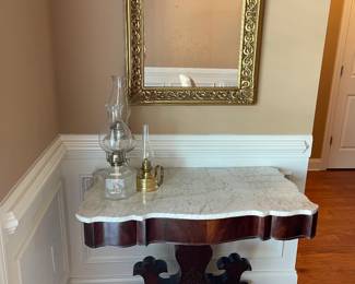 Antique marble top table, mirror, antique oil lamps from early 1920s-1930s