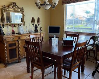 Solid wood table and chairs with a leave