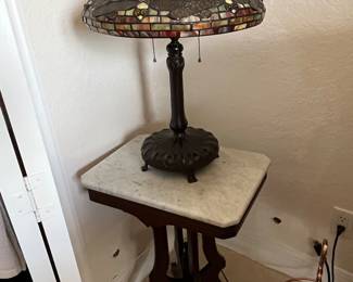 Dragon fly lamps and we have the pair. We have several small marble top tables
