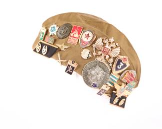 Russian hat with pins, medals, patches