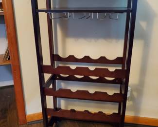 Wine rack, glasses slides, nice size bar top.