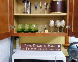 Barware includes a great cocktail shaker, set of cordial glasses, ice bucket, set of green glass tumblers with etched shamrocks, shot glasses, wine glasses.  Kenmore Microwave. The sign speaks for itself.