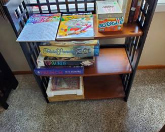 One of two folding shelf units, this one has games and puzzles.