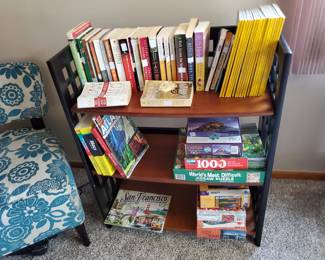 Second of folding shelf unit, books, National Geographics, puzzles.