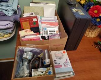 Tons of paper pads, note pads, also stationery and envelopes, some household hardware, a nice briefcase