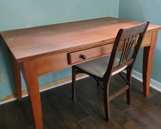 Desk by Cort and a sturdy chair.