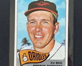 1965 Topps #150: Brooks Robinson. Elected to the HOF in 1983 he played entire 23-year career with the Baltimore Orioles, winning two World Series championships and the 1970 World Series MVP.
