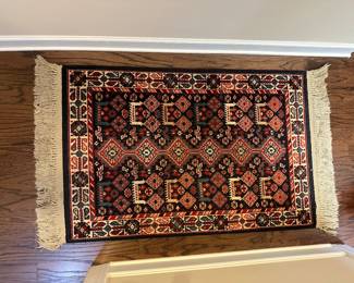 W99 - $40. Karastan area rug measures 48" x 30.5". 