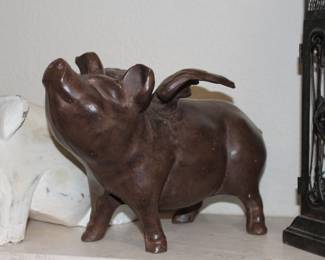 Very heavy cast iron flying pig - can be a large door stopper or just a large heavy decorative cast figure
