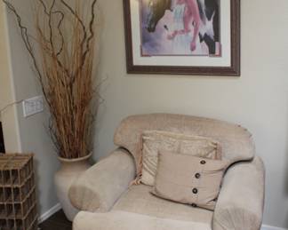 Native art from 1994, decorative vase with sticks and one of the arm chairs