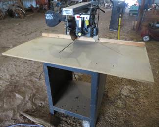 Lot 17. Craftsman radial arm saw with base and dust collector bag. Works