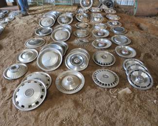 Lot 28. 50-plus old hubcaps