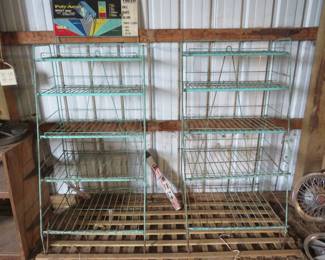 Lot 30. Two wire display racks and one sign advertising Poly-Aqua Products