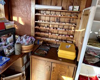 lots of stamps and sewing itemss.  Nice small cabinet