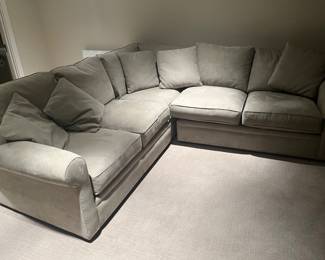 $900  Macy's Sectional 81"wide from the corner each direction x 40"d x 31"h.  Like new condition, neutral color hard to show in a photo