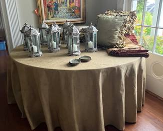 $110. Dining table  particle board 72" round x 30.5"h.  Tablecloth included.  Versatile in that you can dismantle and store, use outdoors in good weather or as an entry piece.