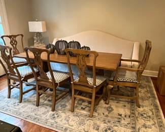 Overview of dining table with sofa used as seating.  Pieces sold and described in following photos