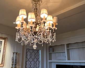 view of chandelier lit up