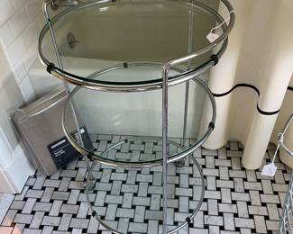 $60 Glass rolling shelving unit