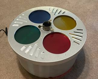 Yes.  This is exactly what you think it is.  For those of you who didn’t immediately gasp, or faint, or jump up and shout Hallelujah, praise the lord! - let me explain.  This is a rotating light wheel that is also a three stand!  Forget about all these old school spotlight wheels, they can only light one side of the three at a time.  This baby lights your tree 360 degrees.  Look them up.  I’ll wait.  