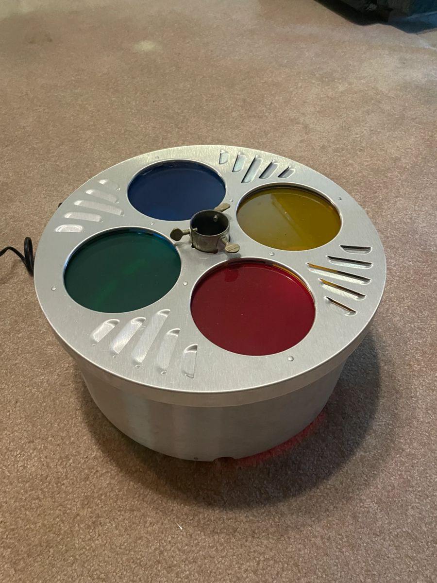 Yes. This is exactly what you think it is. For those of you who didn’t immediately gasp, or faint, or jump up and shout Hallelujah, praise the lord! - let me explain. This is a rotating light wheel that is also a three stand! Forget about all these old school spotlight wheels, they can only light one side of the three at a time. This baby lights your tree 360 degrees. Look them up. I’ll wait.