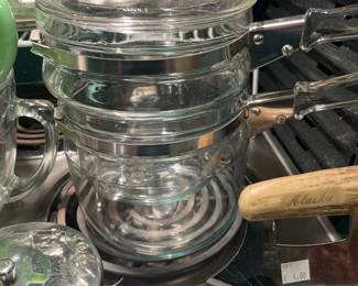 Pyrex double boiler - and the good kind of Pyrex, not the new formula Pyrex that you use to bake a delicious pan of brownies only to hear it explode all over the kitchen when you accidentally set the pan on the vent burner of the stove and then everyone’s mad at you cause they can’t even eat the brownies cause there’s no way to tell if there’s glass all in them.