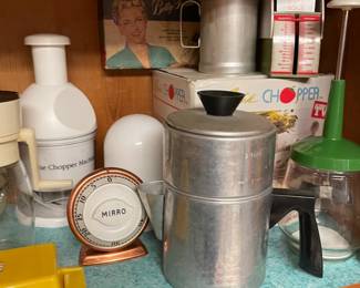 There are like 4 chopping/grinding things on this shelf alone.  Funnily enough none of them could probably grind coffee beans to use in the drop pot.