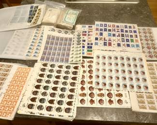 Many pages of uncut vintage stamps (8 cent, 10 cent, 13 cent & 15 cent stamps)