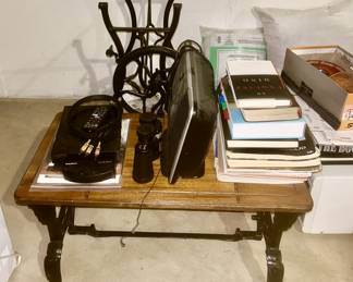 Coffee table made from antique sewing machine base and wooden top, etc.