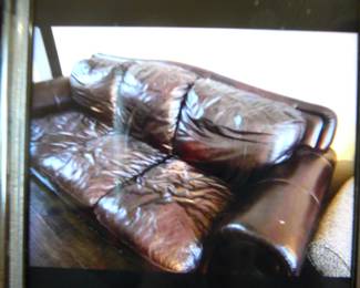 Leather three cushion sofa