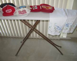 Baseball caps, vintage ironing board
