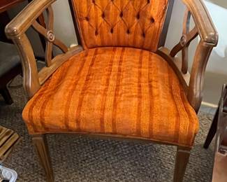 2 orange upholstered armchairs - only one photographed