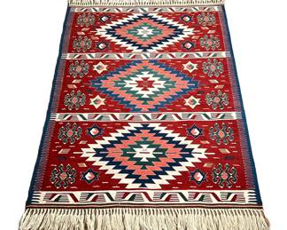 ANATOLIAN WOOL KILIM RUG | Flat woven Killiam rug with three medallions on a red ground and other geometric devices. - l. 64 x w. 43 in