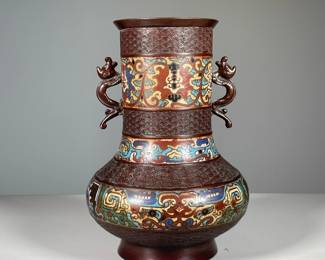 CHAMPLEVE ENAMEL VASE | Having bands of pattern engraving and Champleve enamel and serpent form mounts. - h. 11.5 x dia. 8 in