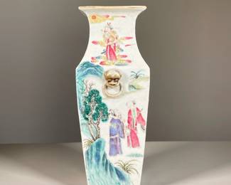 FAMILLE ROSE PORCELAIN SQUARE VASE | Showing procession of figures offering gifts to a dignitary with gods depicted in clouds, applied fu dog mask and ring handles. - l. 5 x w. 5 x h. 12 in