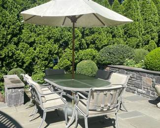 (8PC) BROWN JORDAN PATIO DINING SET | Including; 6 Brown Jordan cushioned dining chairs, oval glass top dining table, and Brown Jordan Hex Umbrella in Brown Jordan labeled umbrella base.  Original total retail price: $9,200  - l. 85 x w. 42.25 x h. 28.75 in