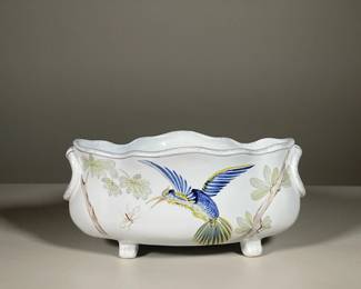 HENRIOT QUIMPER HUMMINGBIRD CENTER BOWL | Footed center bowl with lobed rim, decorated with a humming bird in flight, grasping at an insect. Signed on the bottom and dated "1987"